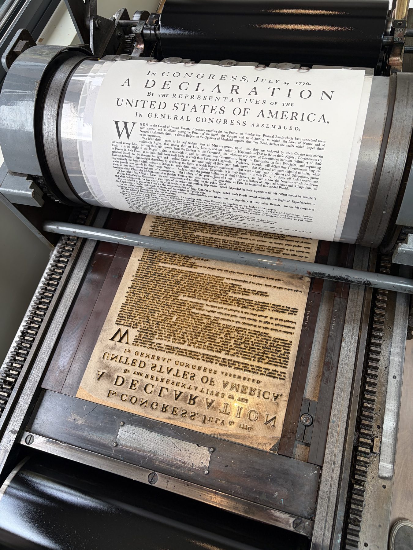 The printed Declaration on the cylinder of the Vandercook 4C, the photopolymer plate on the bed below