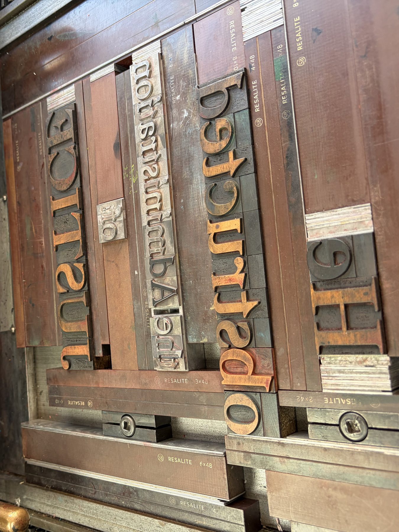 The ‘Justice’ overprint forme — wood and metal type locked up on the press bed